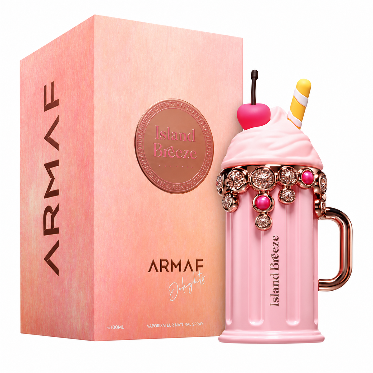 Perfume Island Breeze de Armaf Delights con frasco rosa en forma de batido, cereza y adornos de joyas junto a su caja sobre fondo blanco.