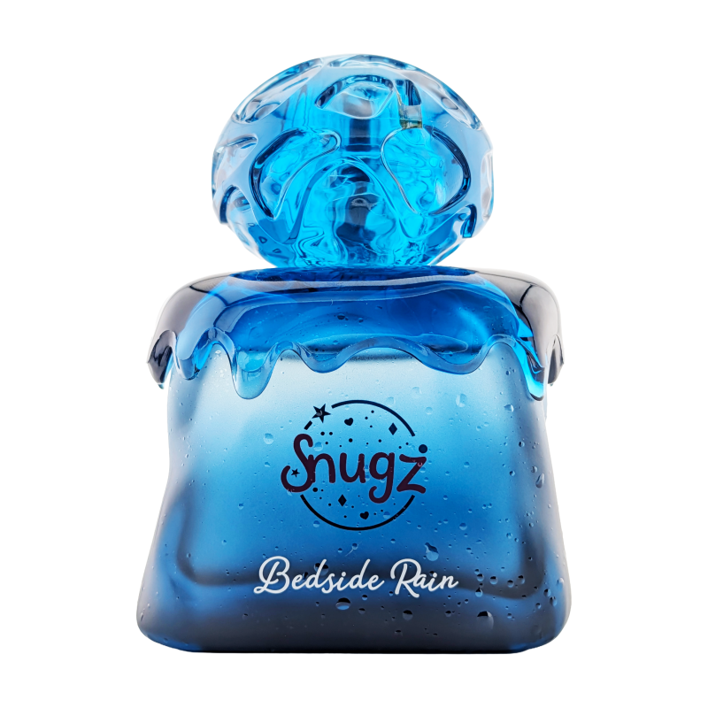 Perfume Bedside Rain de Snugz unisex con notas de grosellas negras, cereza, flor del cerezo, haba tonka y vainilla.