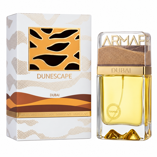 Perfume Dunescape Dubai de Armaf con frasco de cristal y detalles de dunas doradas junto a su caja original sobre fondo blanco.