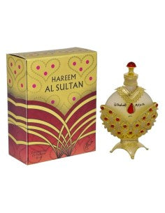 Perfume árabe Hareem Al Sultan Gold de Khadlaj con frasco dorado decorado con detalles rojos y caja original.