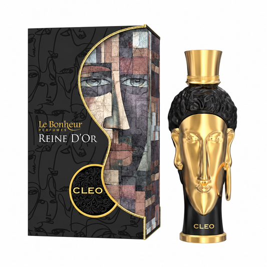 Perfume Reine d’Or Cleo de Le Bonheur con frasco negro y rostro dorado junto a su caja original sobre fondo blanco.