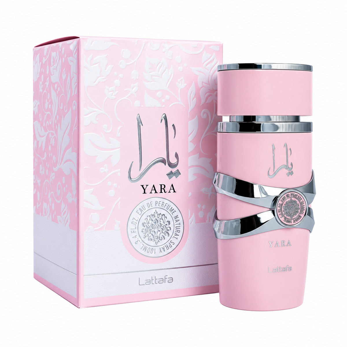 Perfume Yara rosa de Lattafa de 100 ml con frasco rosa y bandas plateadas junto a su caja floral original sobre fondo blanco.